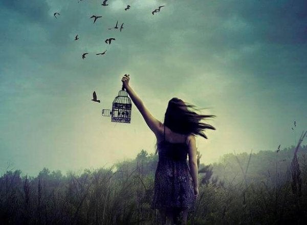 Woman freeing birds